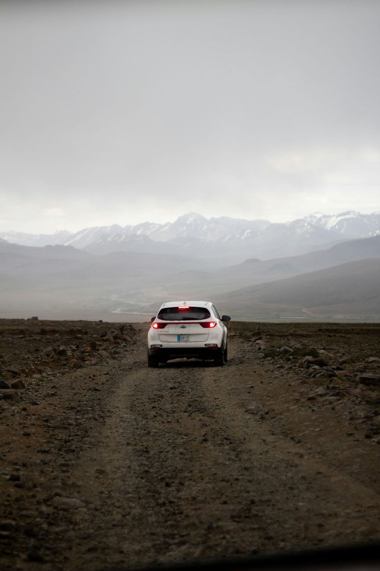 White 4x4 on the dirt road across the Deosai plateau, Deosai National Park, Astore side