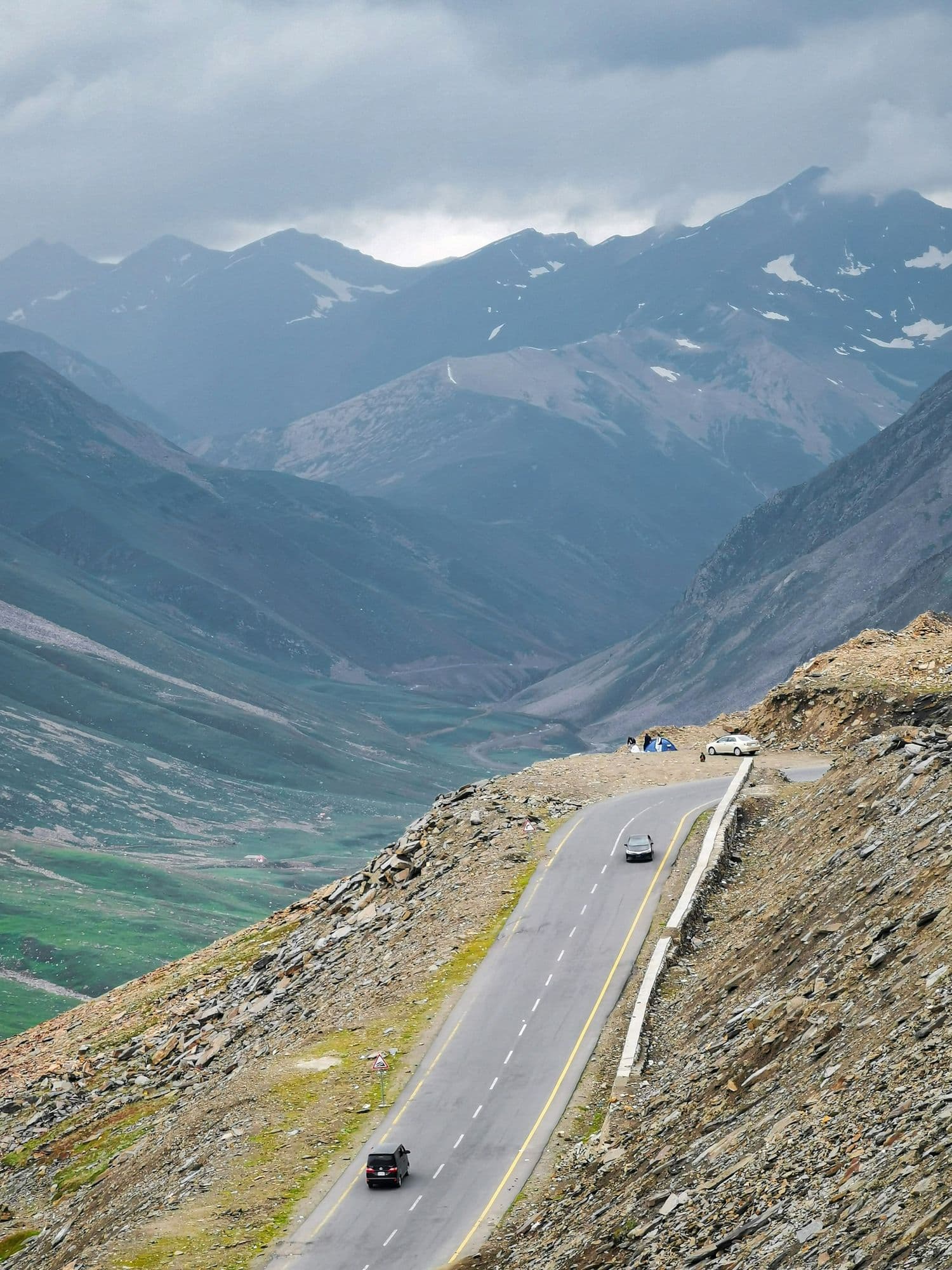 Cars descending the switchback road at Babusar Top, the 4,173 m pass between Naran and Chilas