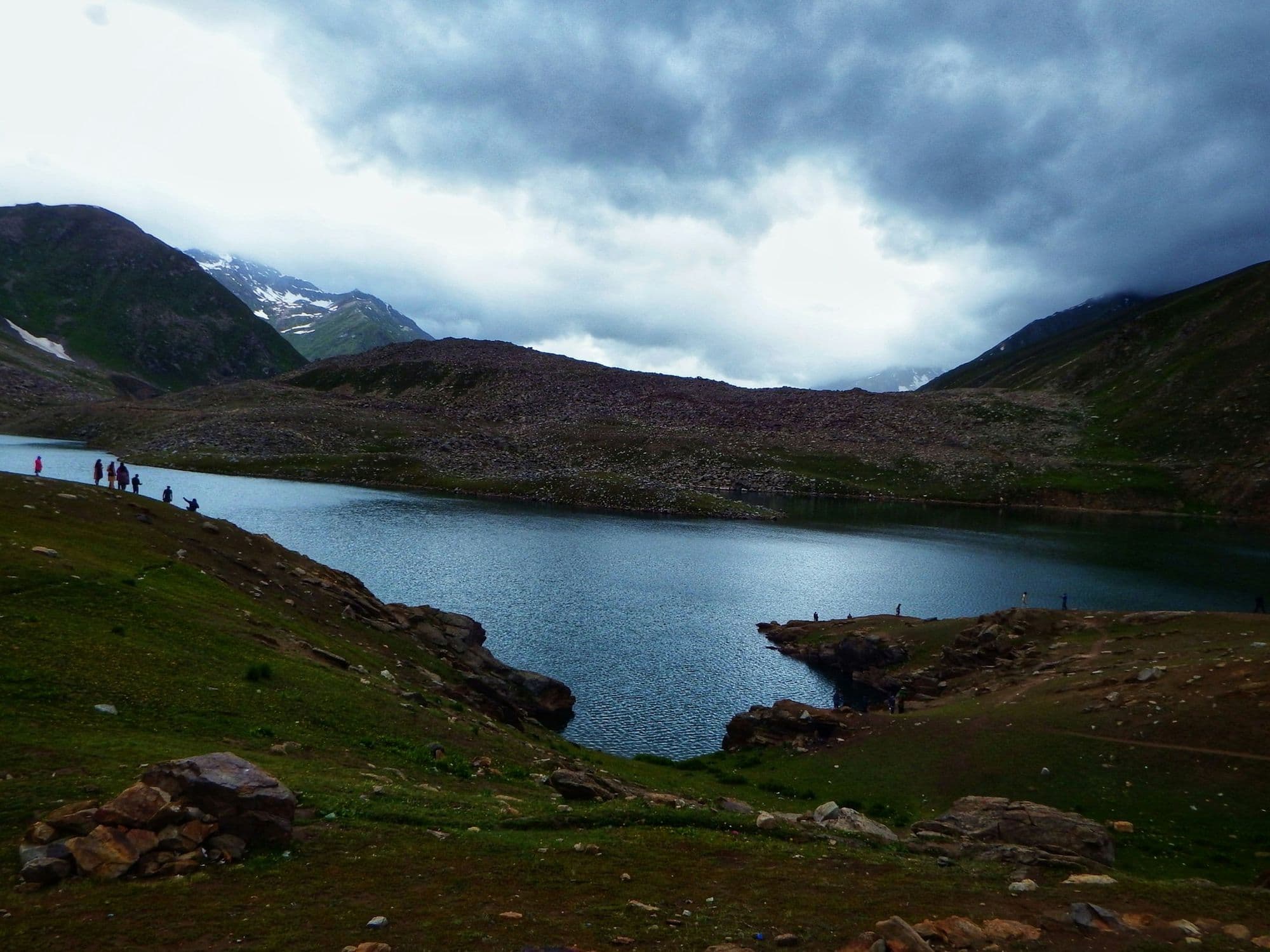 Lulusar Lake beside the Naran–Babusar road in Kaghan Valley, with visitors on the shore