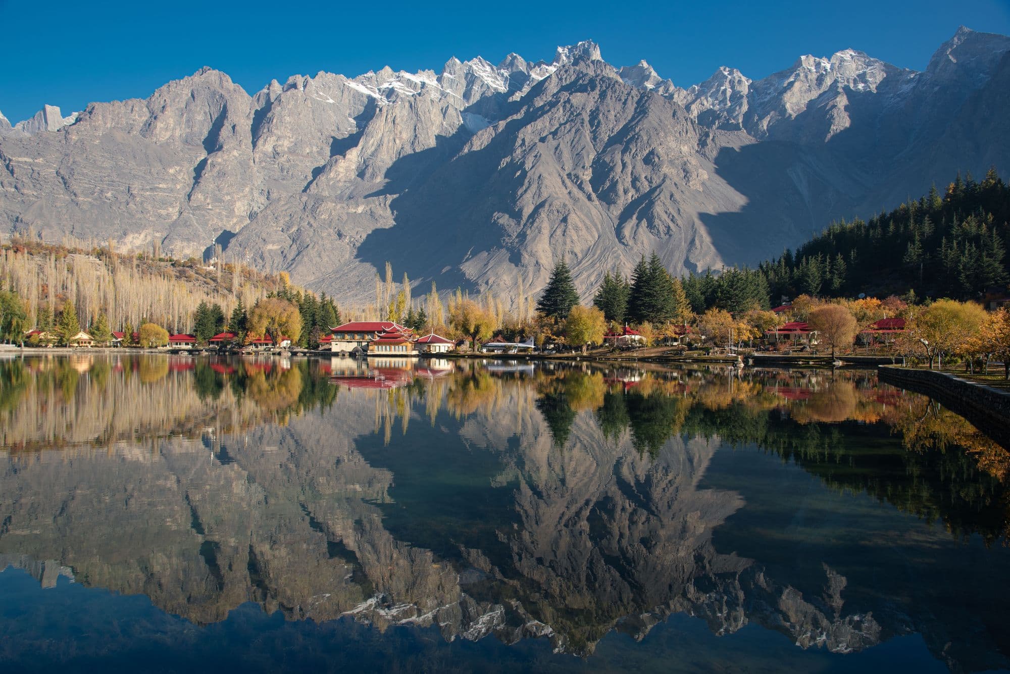 Autumn colours and mountains reflected in Lower Kachura (Shangrila) Lake near Skardu