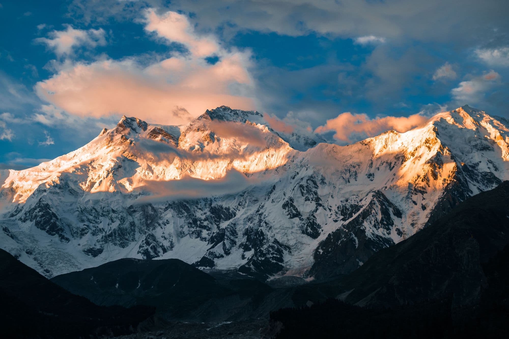 Sunrise lighting the snow-covered summit of Nanga Parbat above a sea of clouds, Gilgit-Baltistan