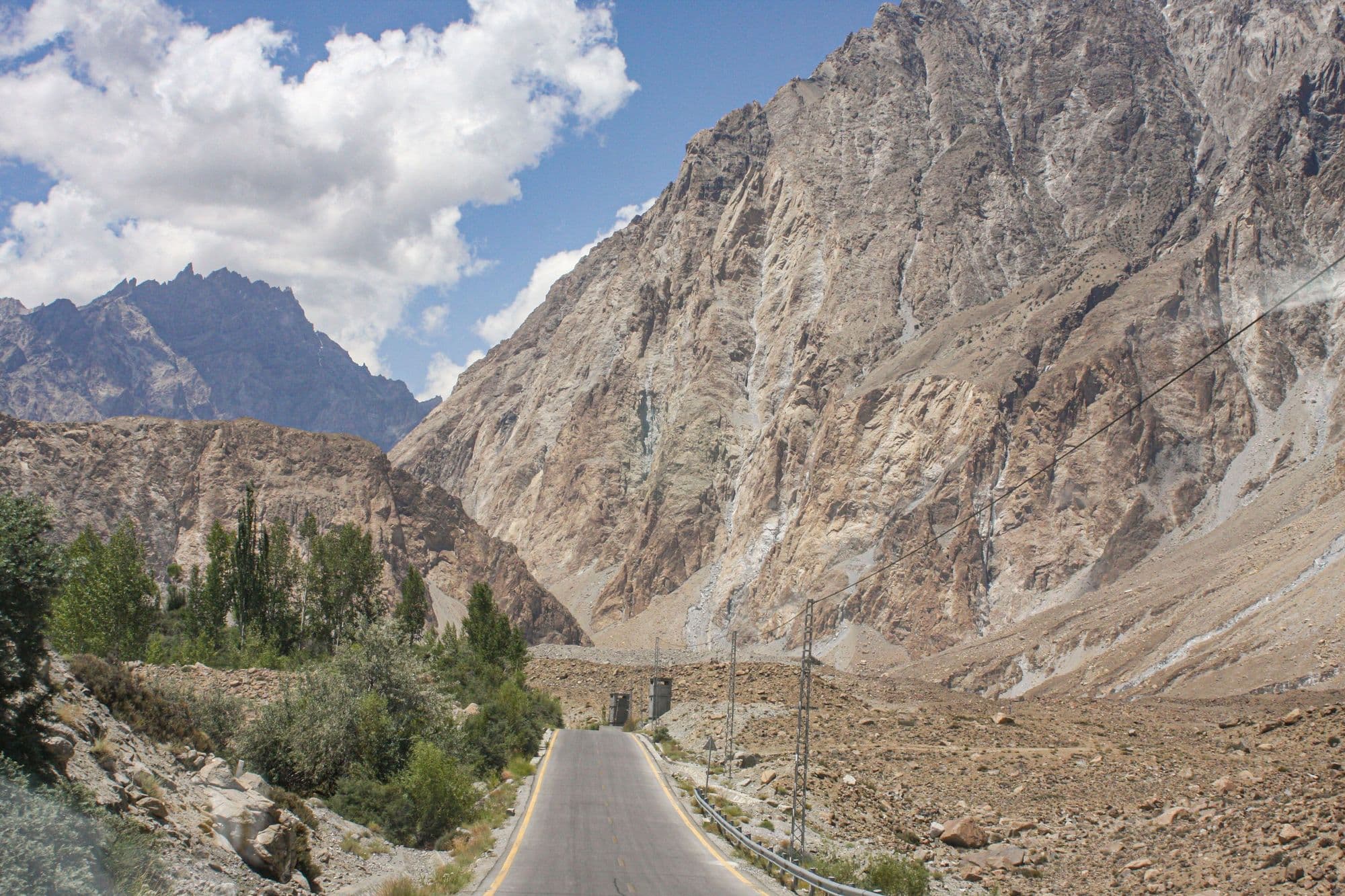 The Karakoram Highway winding between bare rock mountains in upper Hunza on the way to Khunjerab Pass