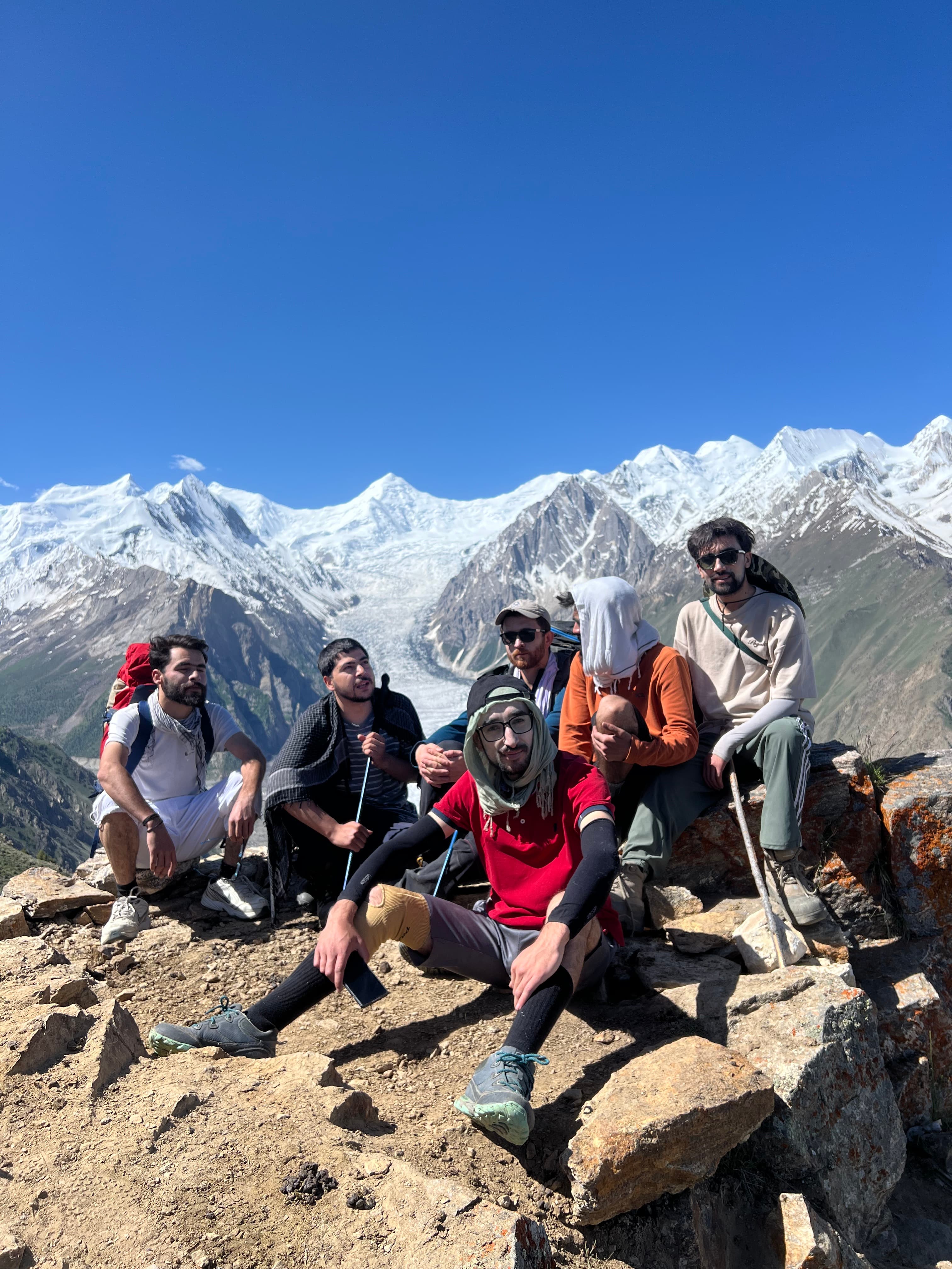 A Third Pole Adventures guide sharing a moment with travelers in the mountains