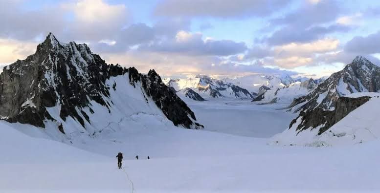 Dawn light over the Lukpe Lawo snow lake basin in the Karakoram, Pakistan